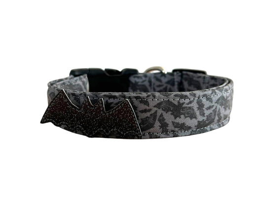 Gray dog collar with a black bat pattern and a sparkly black bat embellishment attached to the front.