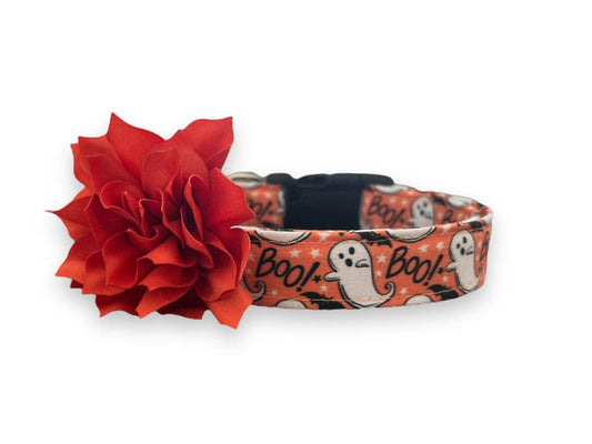 Orange Halloween dog collar with playful ghosts, black bats, “Boo!” text, and a detachable flower embellishment.
