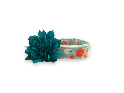 Brighten up spooky season with this aqua Halloween dog collar featuring pink, white, and orange pumpkins. Includes a removable 3" or 4" flower in your choice of color.