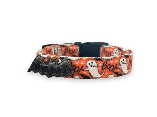 Halloween-themed dog collar with ghosts and bats on an orange background.