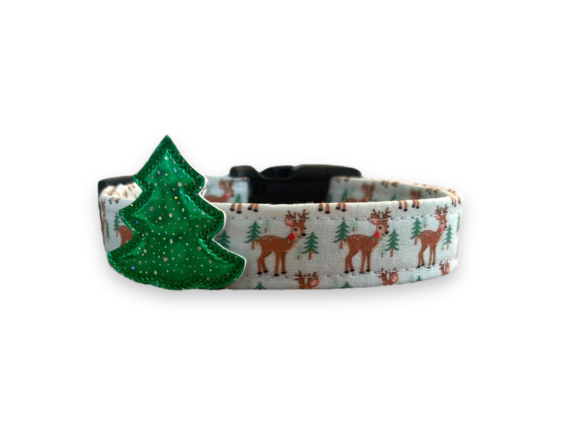 Pale blue Woodland Christmas dog collar with reindeer and evergreen tree pattern, shown with removable tree embellishment attached.