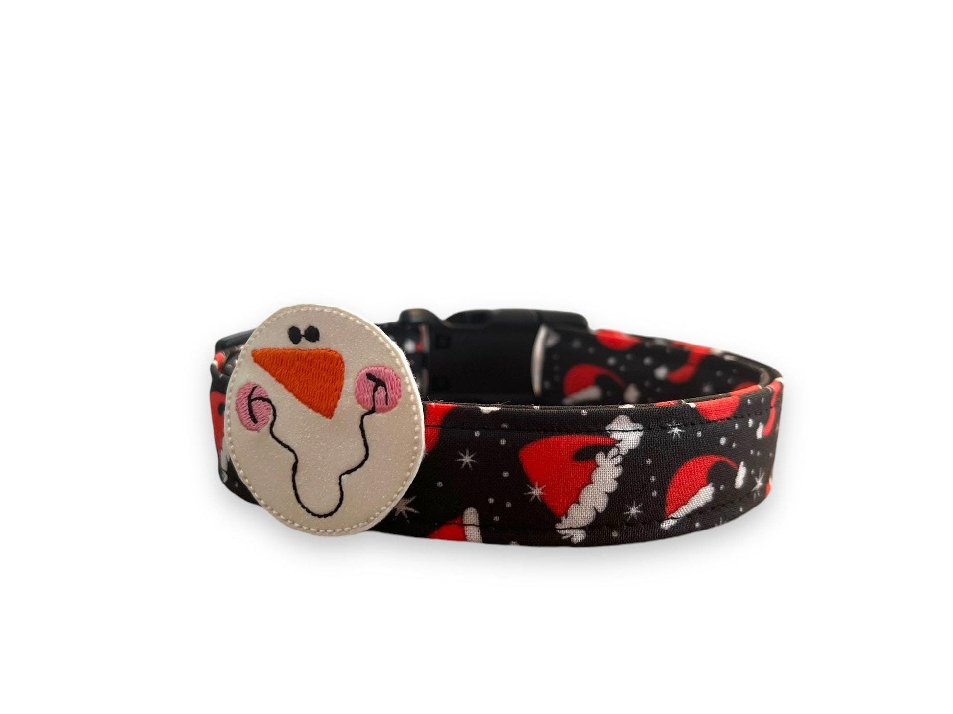 Black Christmas dog collar with red Santa hats and white snowflakes