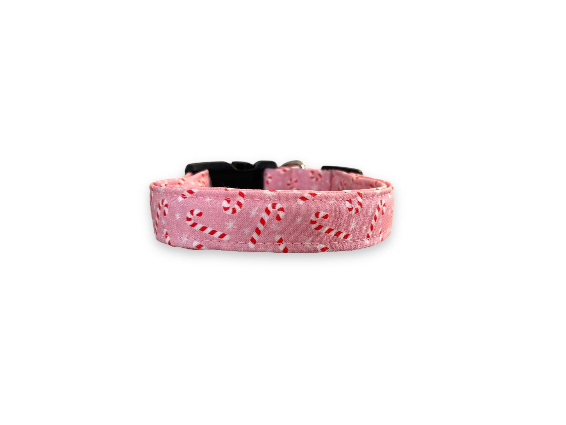 Light pink Christmas dog collar decorated with peppermint candy canes and snowflakes.