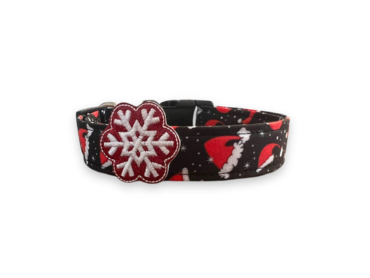 Black Christmas dog collar with red Santa hats and white snowflakes