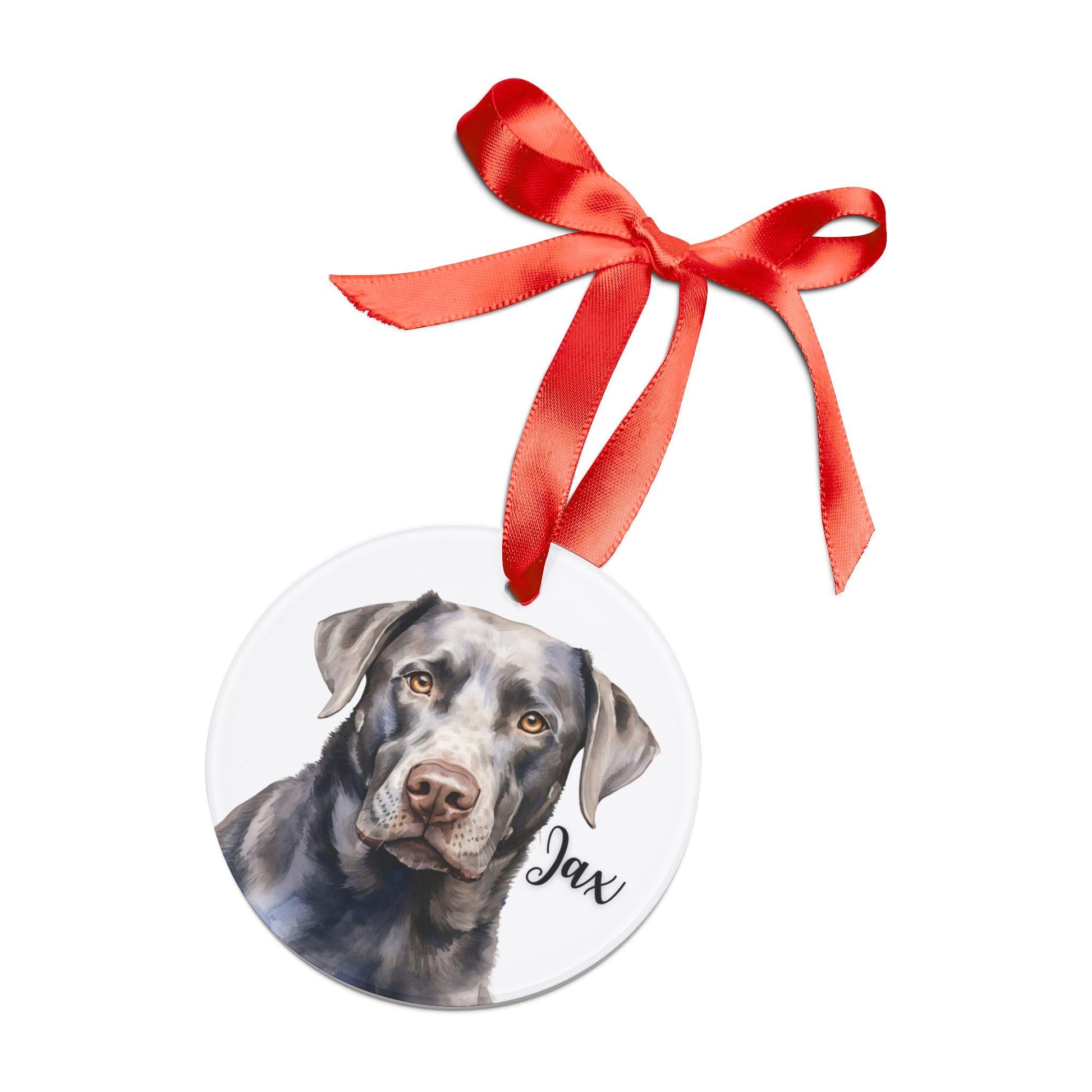 Round acrylic Christmas ornament featuring a watercolor silver Labrador, personalized with the dog’s name and finished with a red ribbon for hanging.
