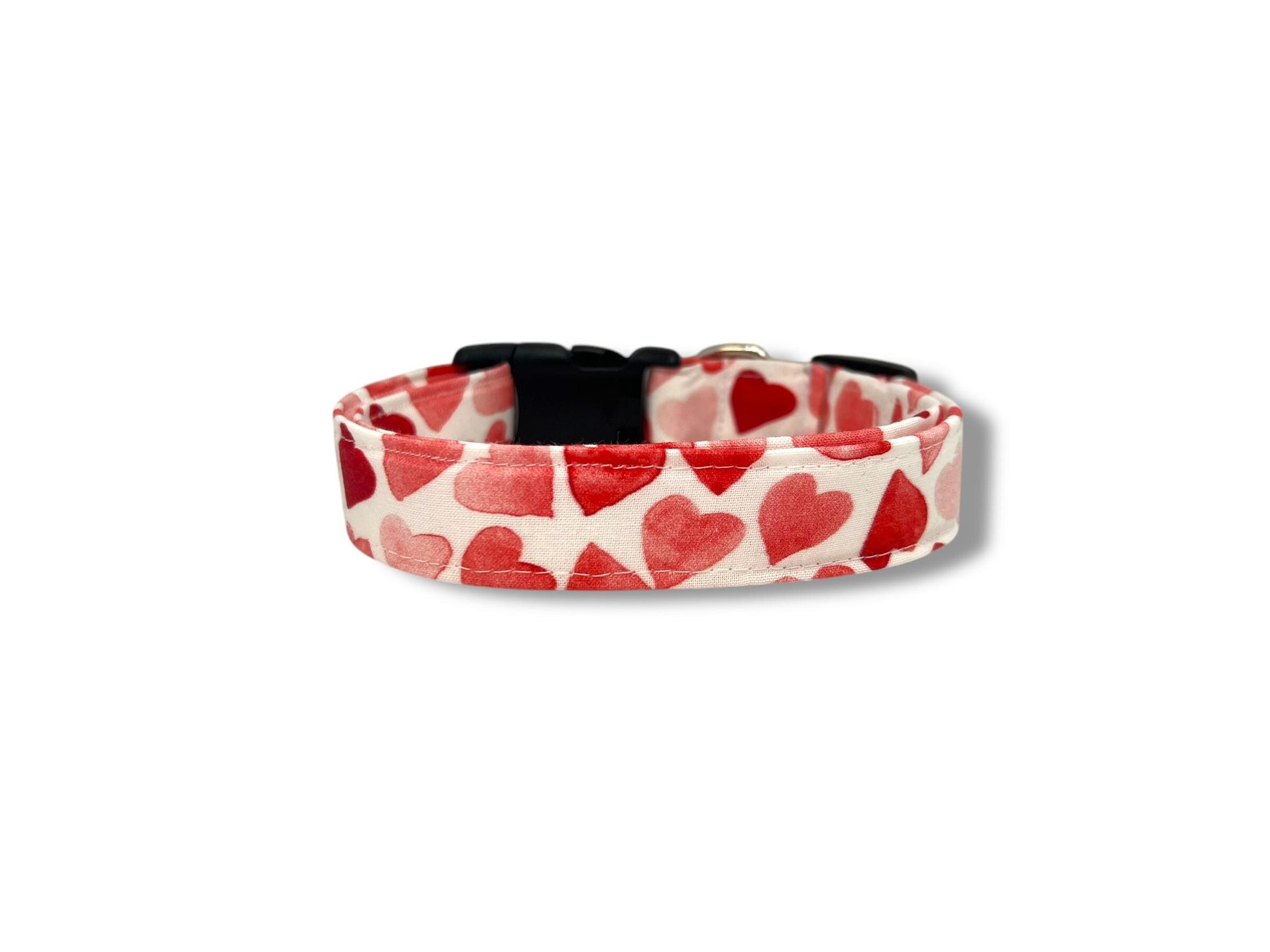 Dog collar with red heart pattern on a white background