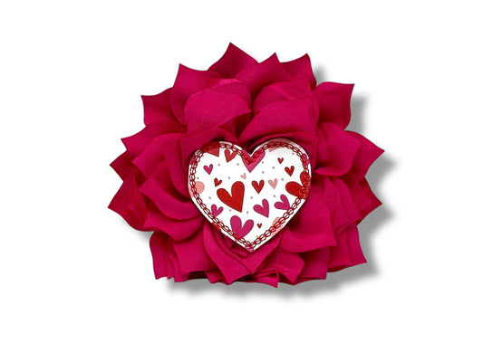 Valentine’s Day dog collar flower with heart embellishment and fluffy layered petals, shown in a 4-inch shocking pink size with elastic collar loop.