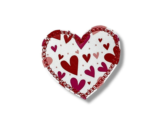 White heart dog collar embellishment with tiny red and pink hearts and elastic loop for easy collar attachment.