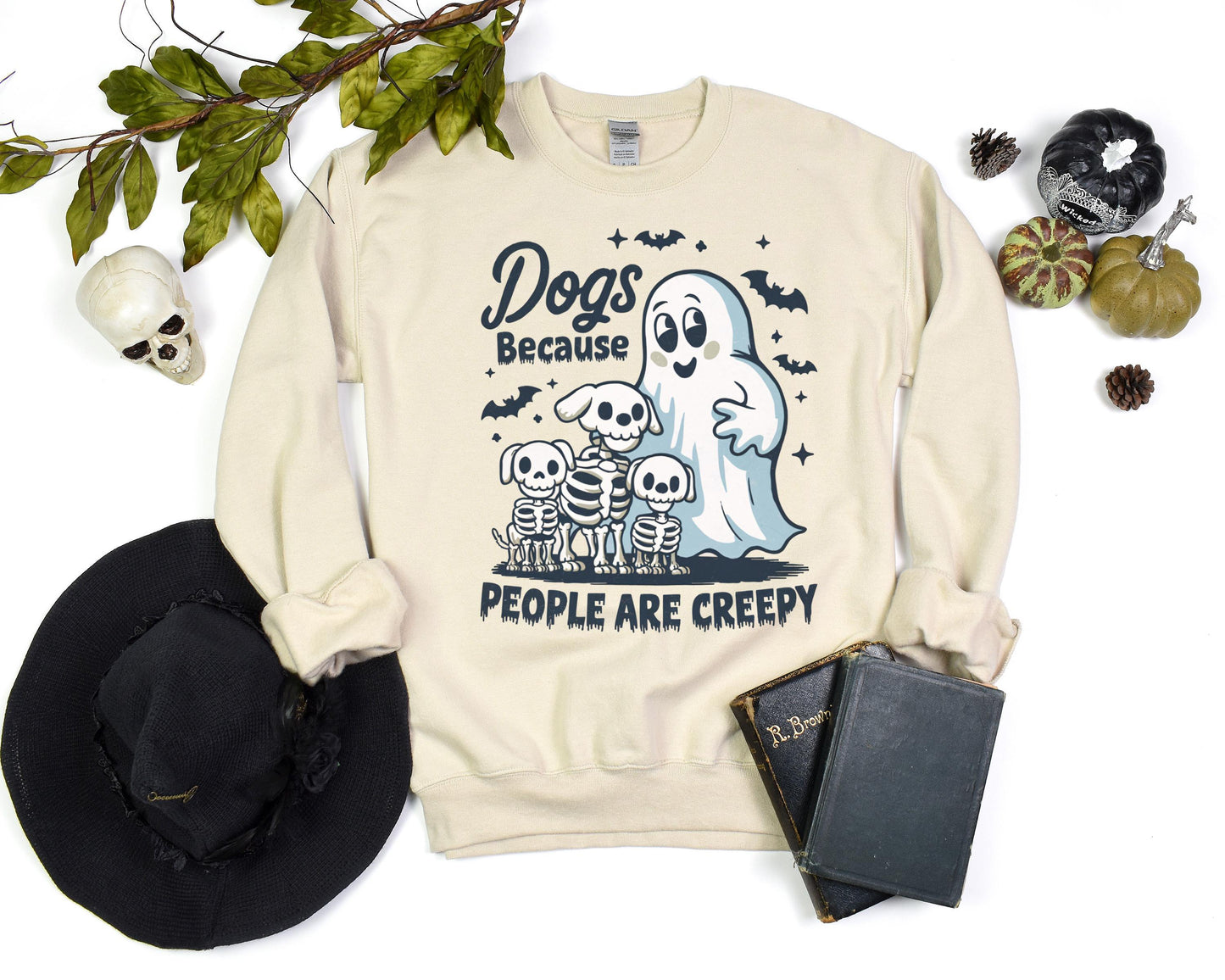 Halloween dog sweatshirt with a ghost, playful dogs, and the phrase “Dogs Because People Are Creepy,” made from soft, cozy fabric for fall weather.