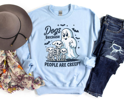 Halloween dog sweatshirt with a ghost, playful dogs, and the phrase “Dogs Because People Are Creepy,” made from soft, cozy fabric for fall weather.