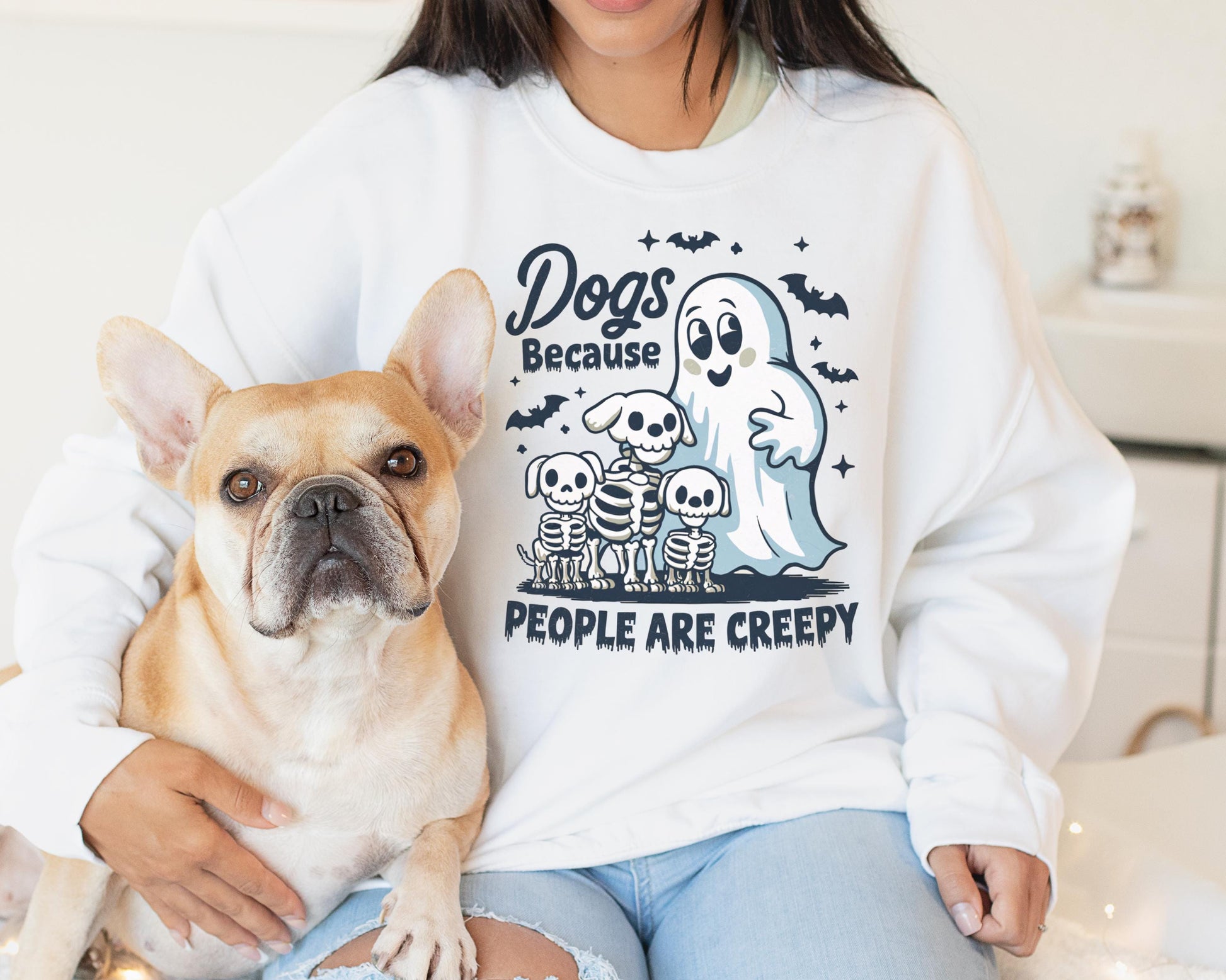 Halloween dog sweatshirt with a ghost, playful dogs, and the phrase “Dogs Because People Are Creepy,” made from soft, cozy fabric for fall weather.