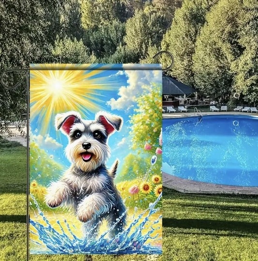 Schnauzer garden flag showing a happy Schnauzer splashing in a puddle on a sunny day, surrounded by colorful flowers in a vibrant outdoor scene.