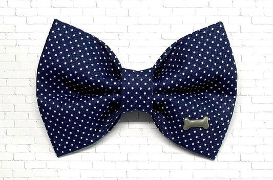 Navy blue dog bow tie with tiny white polka dots, perfect for a classic and stylish pup look.