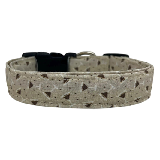 Beige dog collar featuring a playful espresso martini-themed print with tiny martini glasses and coffee beans, laid flat on a white background.