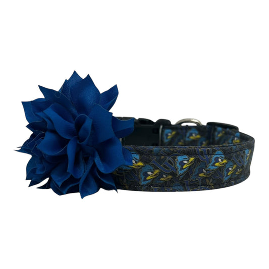 Navy blue dog collar featuring the University of Delaware UD logo and Blue Hens graphics with nautical blue dog collar flower, laid flat on a white background.
