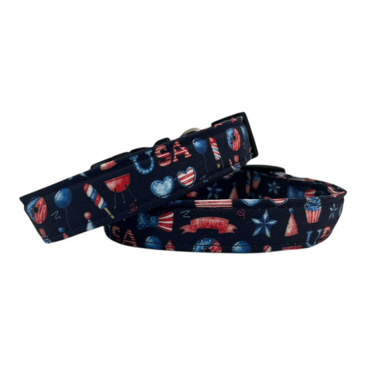 Navy blue 4th of July dog collar decorated with red, white, and blue icons like popsicles, BBQ grills, fireworks, and balloons.