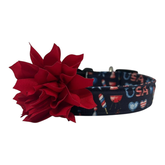 Navy blue 4th of July dog collar featuring red, white, and blue icons like popsicles, BBQ grills, fireworks, and balloons, paired with a detachable 3" or 4" flower in your choice of color.
