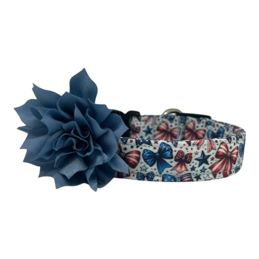 Patriotic dog collar with red, white, and blue bows and stars on a light background, shown with a detachable flower accessory in the color of your choice.