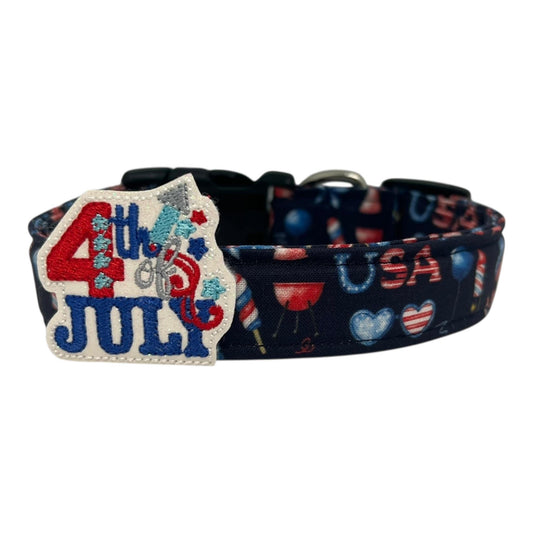 Navy blue 4th of July dog collar decorated with red, white, and blue icons like popsicles, BBQ grills, fireworks, and balloons with a removable 4th of July dog collar embellishment.