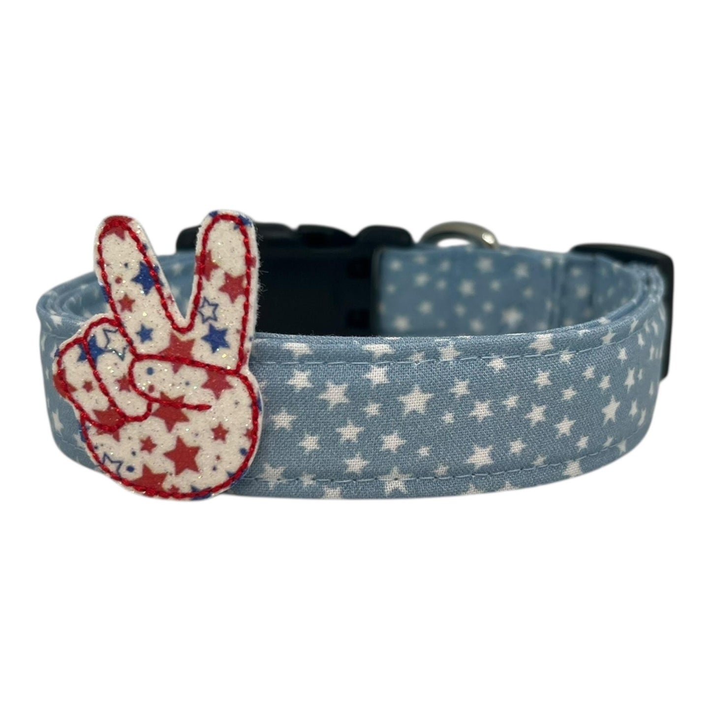 Light blue chambray dog collar with scattered white stars featuring a star filled peace sign embellishment.
