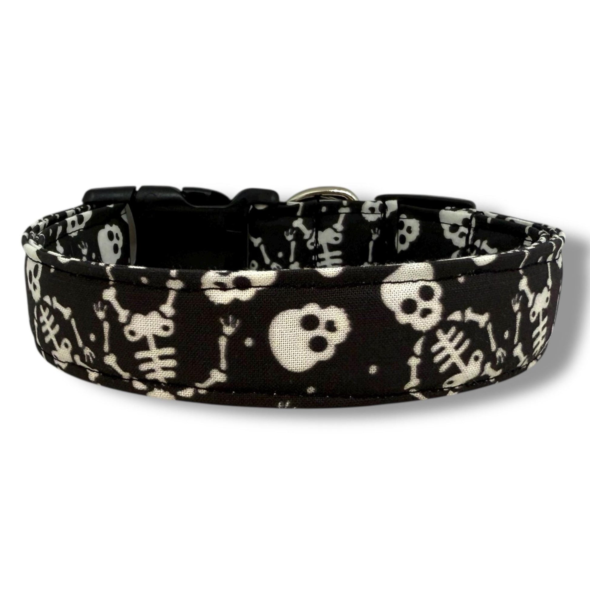 Black Halloween dog collar with playful skeletons and skulls.