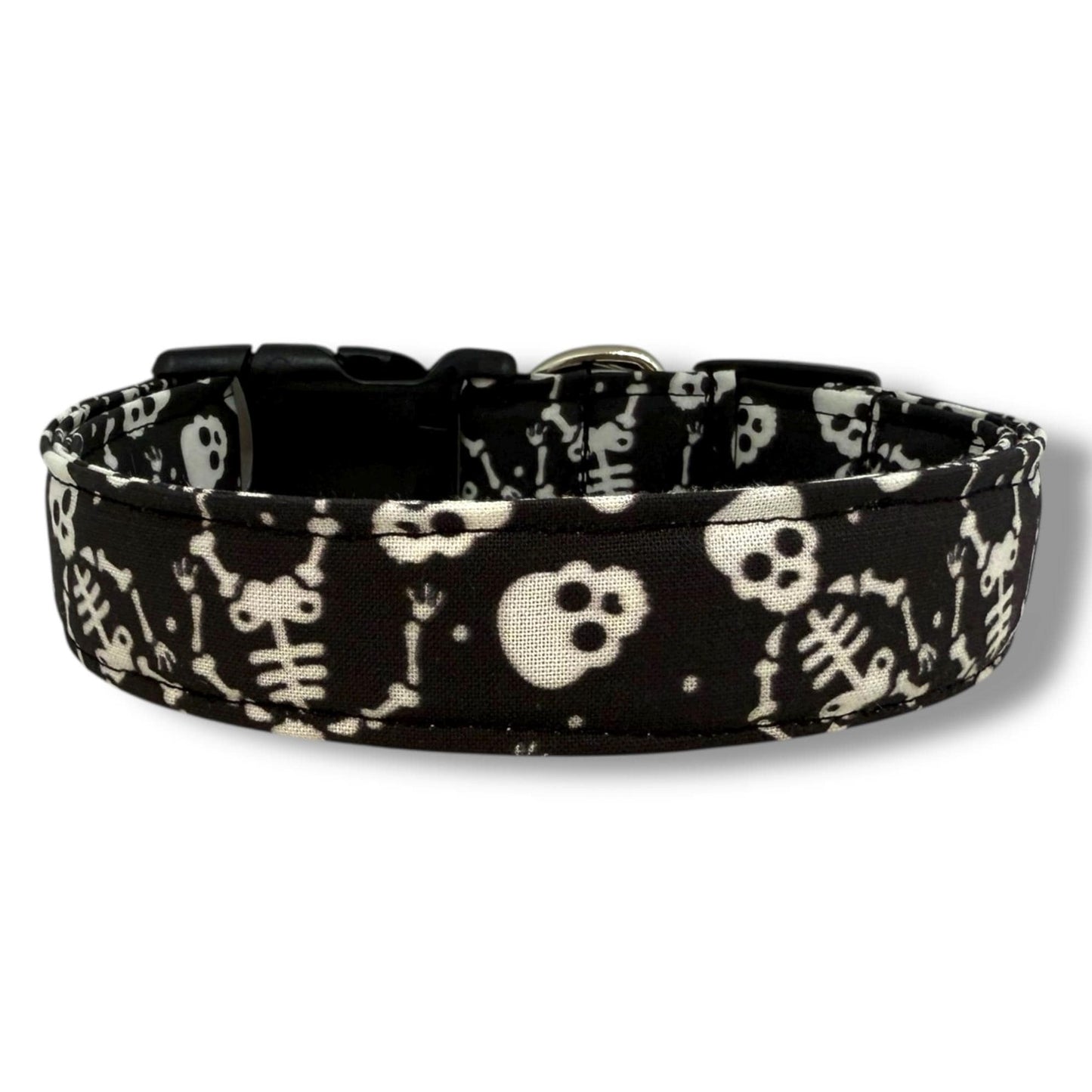 Halloween dog collar with playful skeleton and skull pattern on a black background for spooky seasonal style.