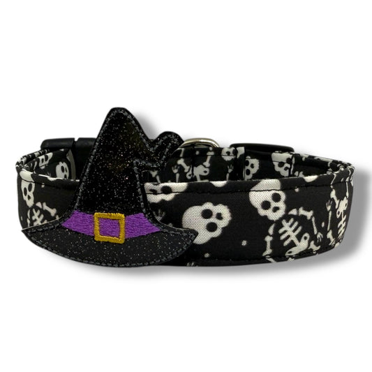 Halloween dog collar with skeletons and skulls on a black background, includes removable shimmery witch hat embellishment.