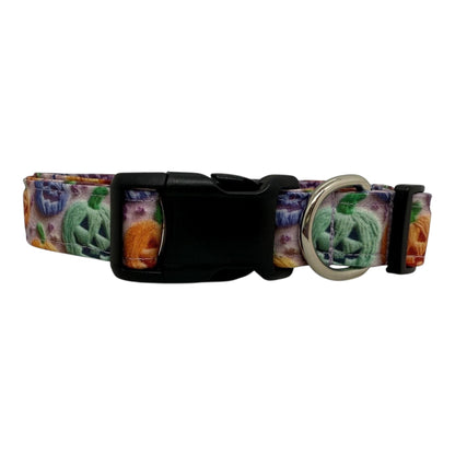 Halloween dog collar with rainbow jack-o’-lanterns in orange, green, purple, and blues.