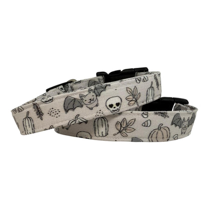 Dog collar with Halloween-themed pattern on a white background