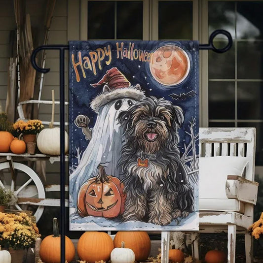 Decorative Halloween flag with a ghost and dog in front of pumpkins and a moon.