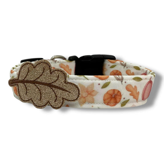 Fall dog collar with pumpkins, golden leaves, autumn blooms, and removable beige leaf embellishment in warm, earthy tones.