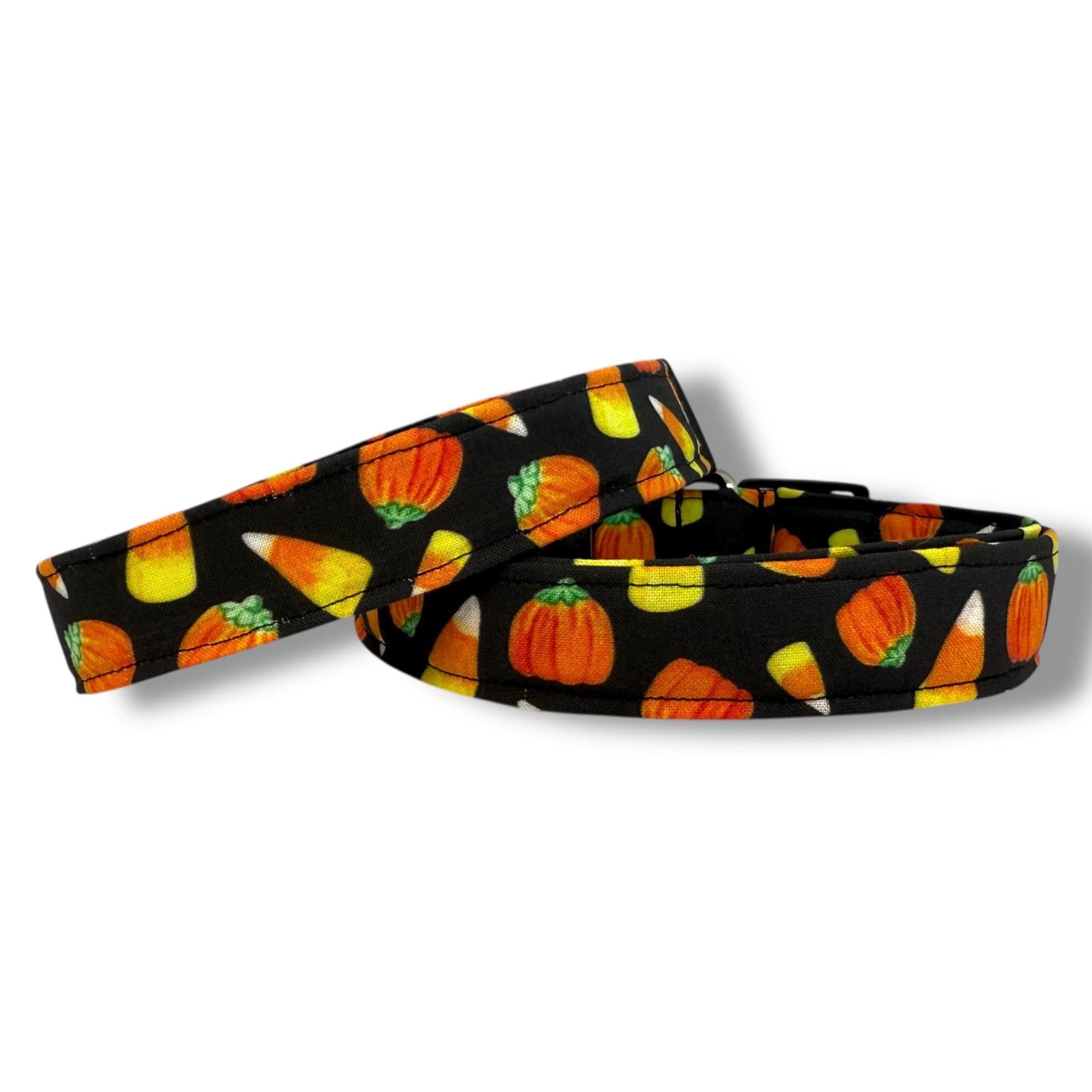 Halloween dog collar with candy corn and mellowcreme pumpkin pattern on a black background for festive fall style.