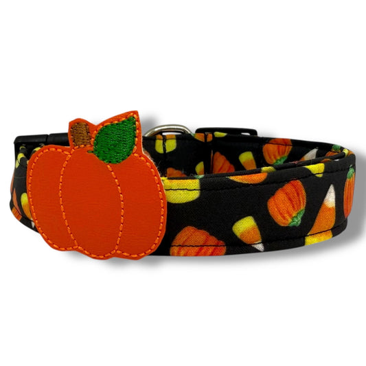 Halloween dog collar with candy corn and pumpkin pattern on black background, includes removable leather-like pumpkin embellishment.