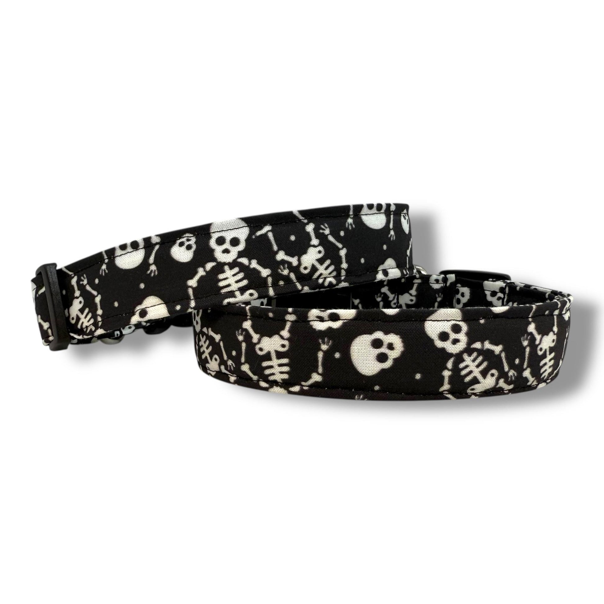 Black Halloween dog collar with playful skeletons and skulls.