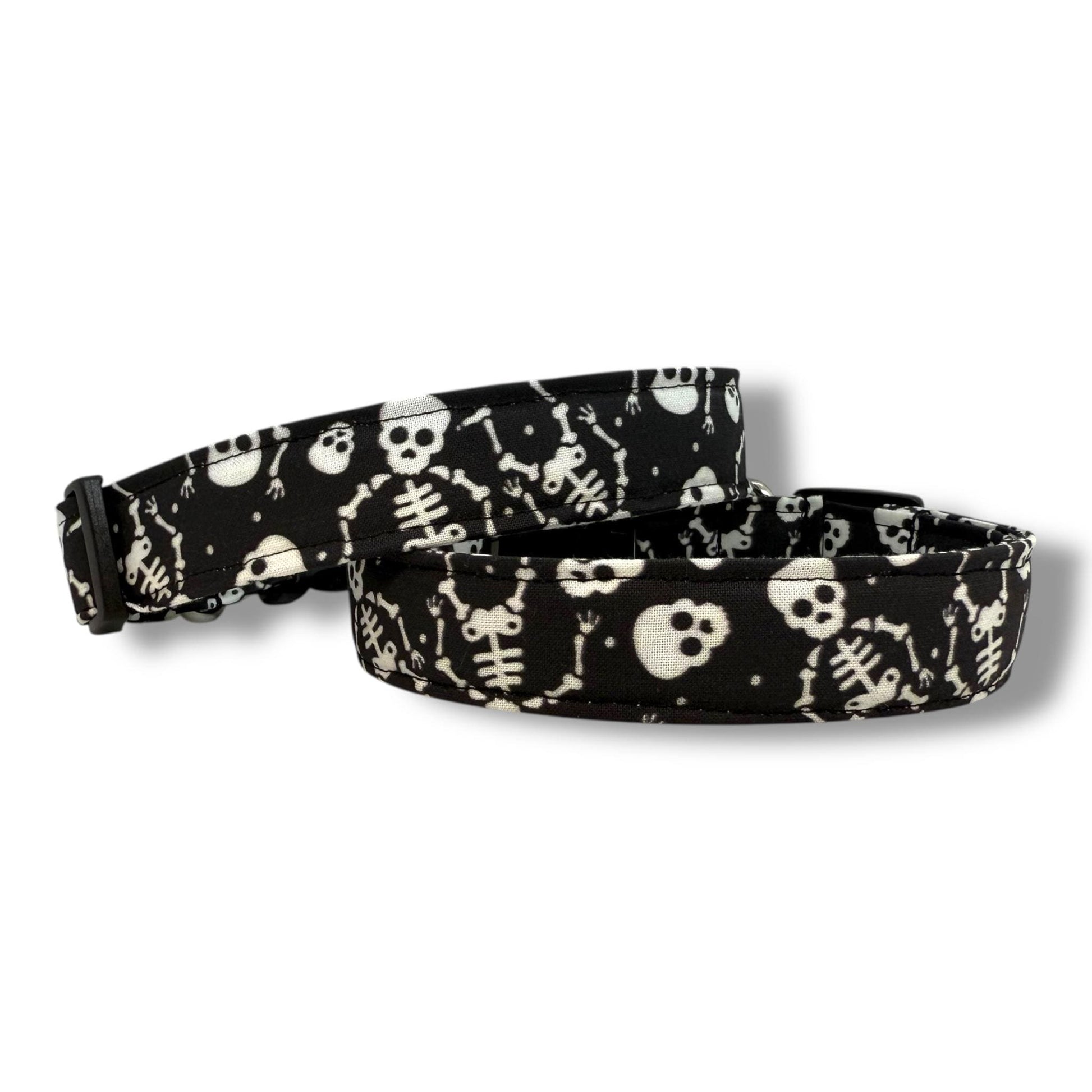 Halloween dog collar with skeleton and skull pattern on a black background.