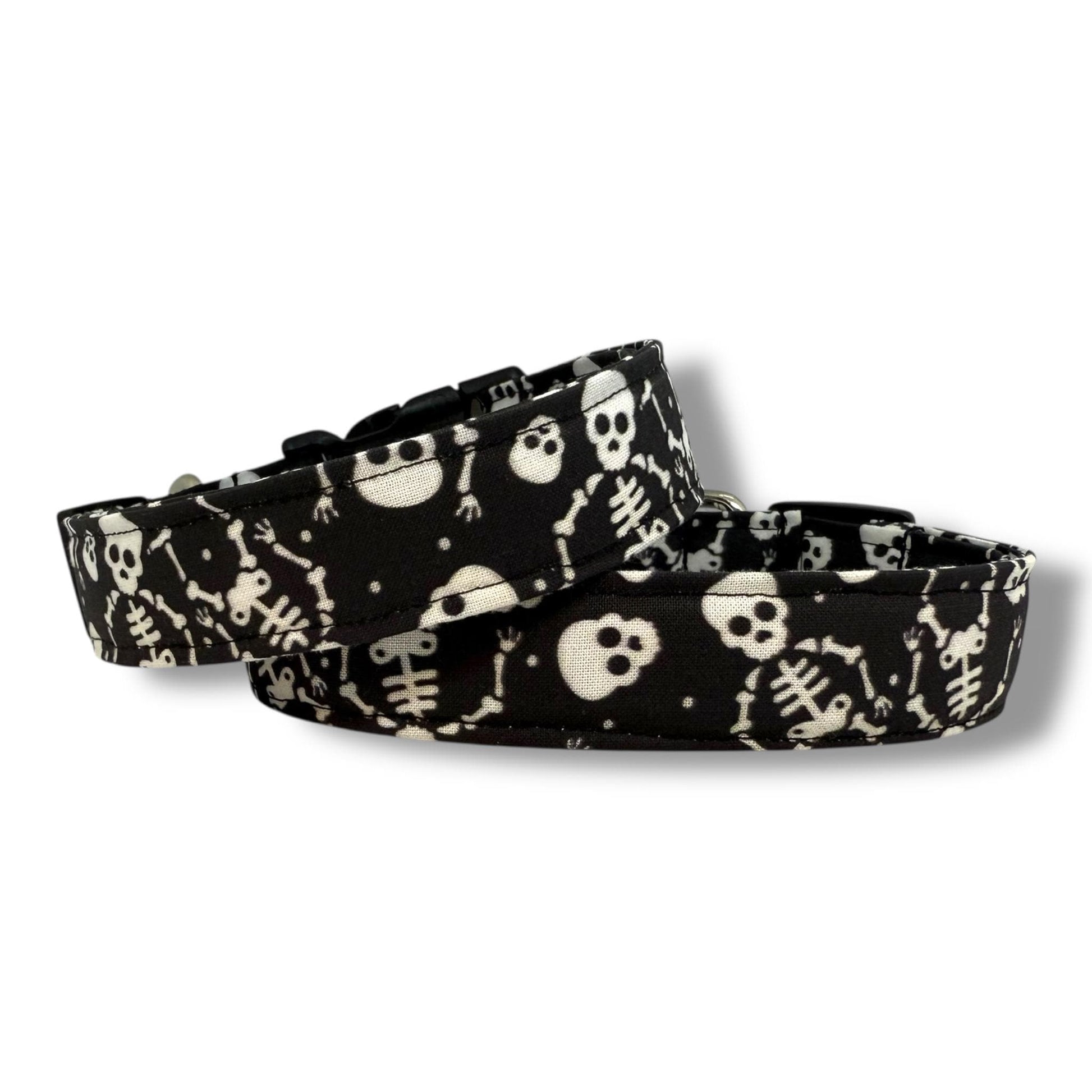 Halloween dog collar with skeletons and skulls on a black background.