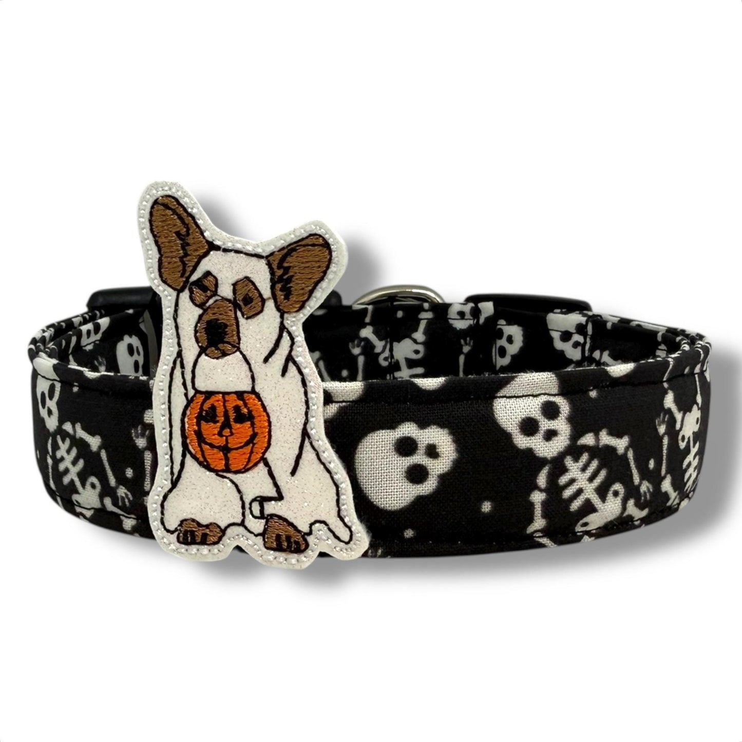 Halloween dog collar with skeleton and skull pattern on black background, includes removable shimmery ghost dog embellishment.