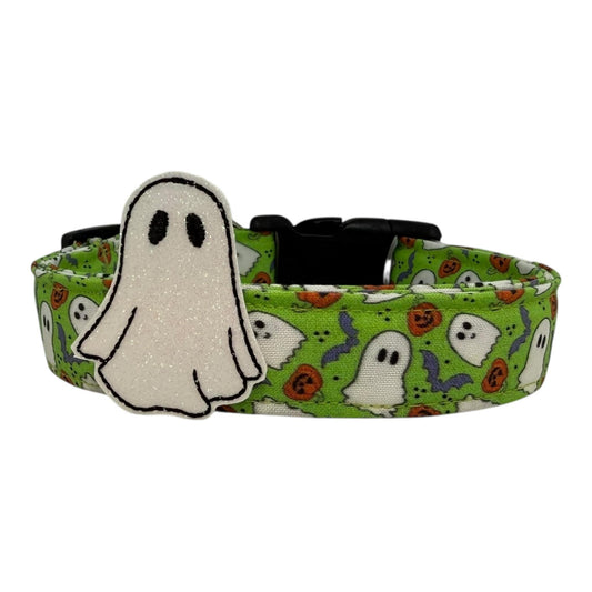 Halloween dog collar with ghosts, pumpkins, and bats on a bright green background, includes removable shimmery ghost embellishment.