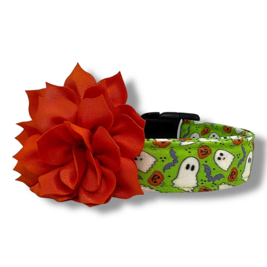 Bright green Halloween dog collar with ghosts, pumpkins, bats, and removable orange flower embellishment in 3" or 4" size.