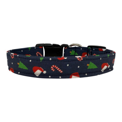 Navy cotton dog collar printed with small Christmas icons. The collar has a side-release buckle and metal D-ring, handmade and adjustable in multiple sizes.