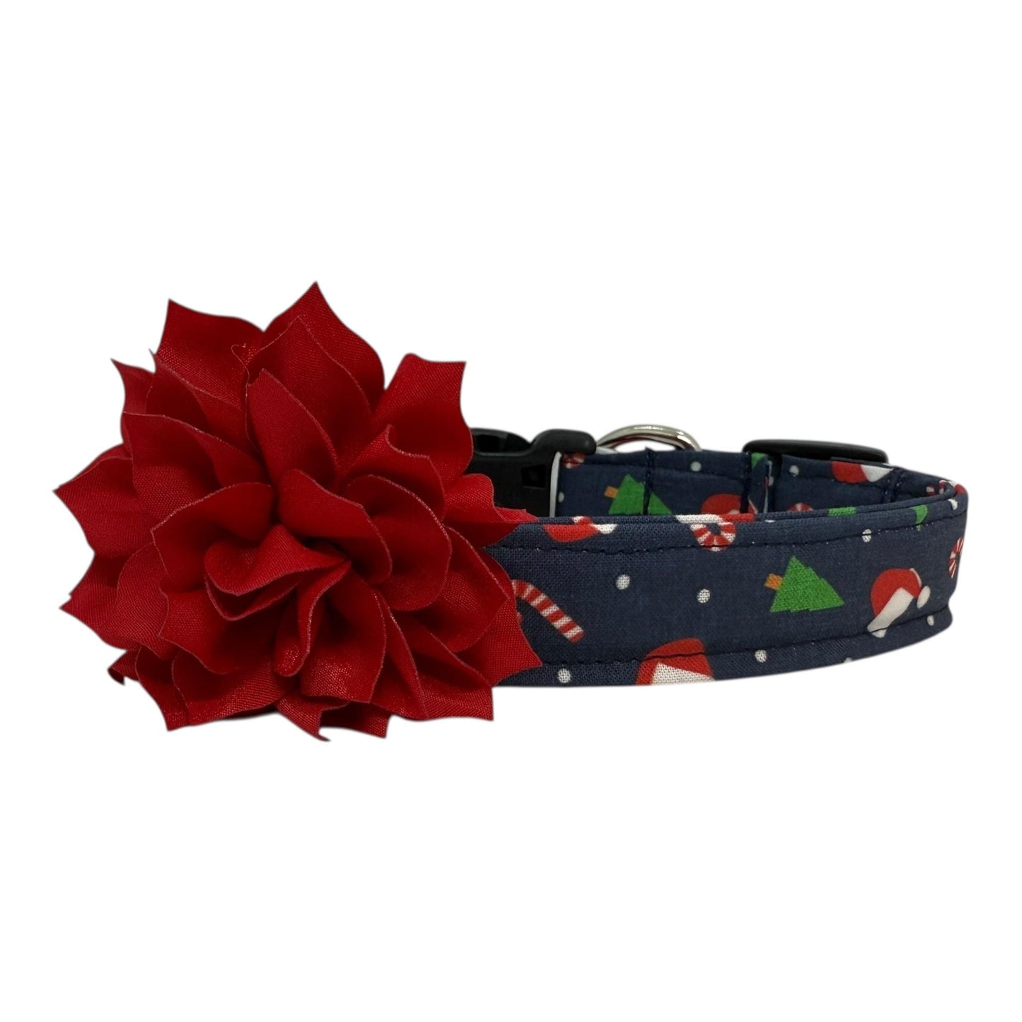 Navy cotton dog collar printed with small Christmas icons, featuring a removable red dog collar flower, side-release buckle and metal D-ring, handmade and adjustable in multiple sizes