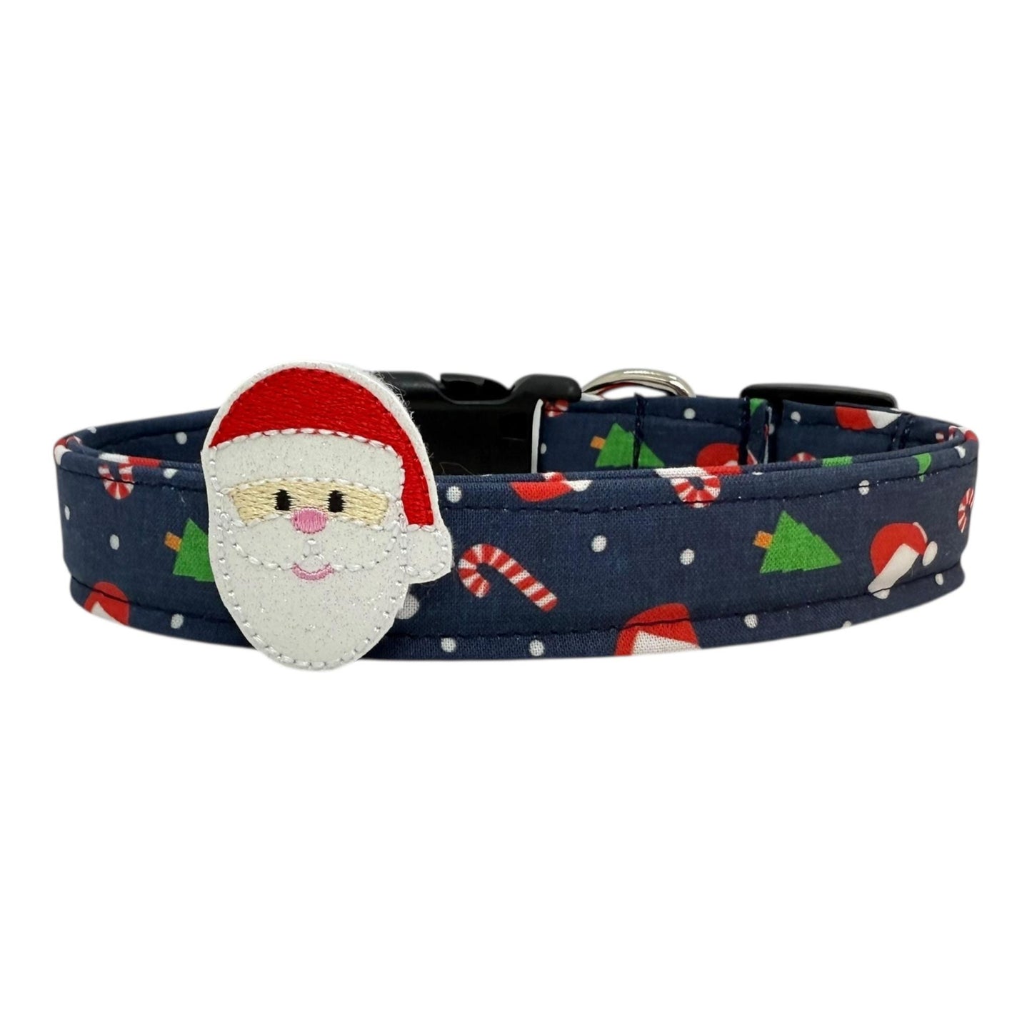 Navy Christmas dog collar with festive holiday icons with removable Santa face embellishment. Handmade with durable nylon webbing, side-release buckle, and welded D-ring. Adjustable sizes XS–XL.