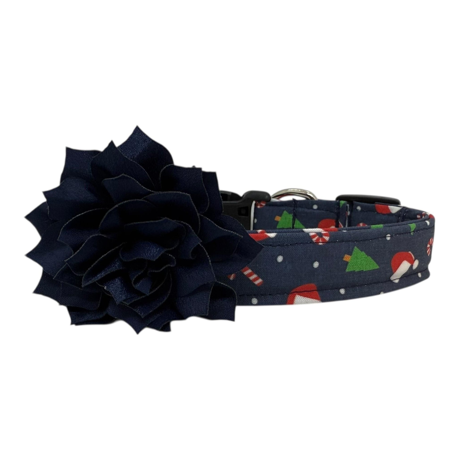 Navy cotton dog collar printed with small Christmas icons, featuring a removable navy dog collar flower, side-release buckle and metal D-ring, handmade and adjustable in multiple sizes
