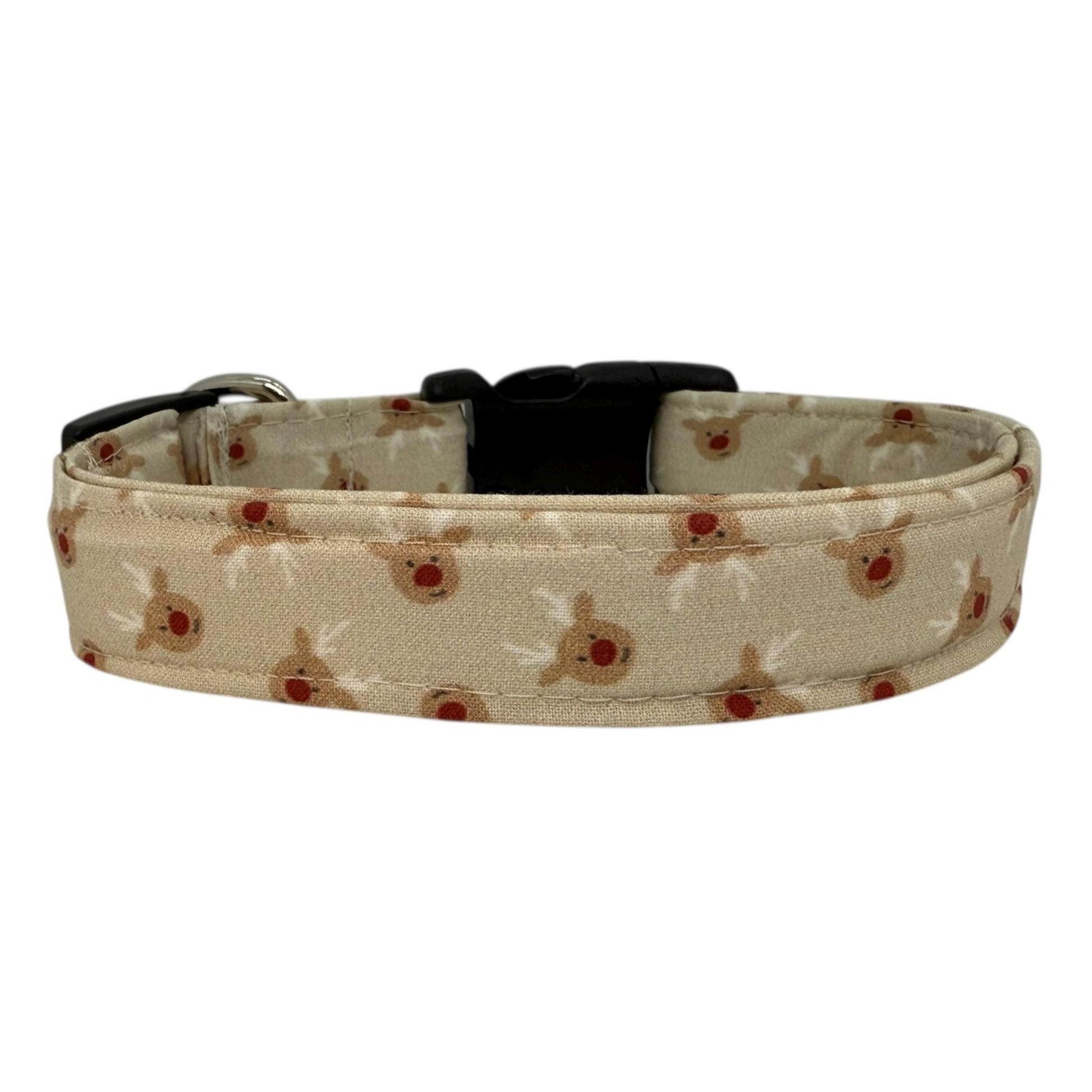 Beige dog collar with small red-nose reindeer faces, adjustable with black buckle and metal D-ring