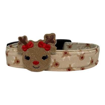Beige dog collar with small red-nose reindeer faces and a removable reindeer embellishment attachment, adjustable with black buckle and metal D-ring
