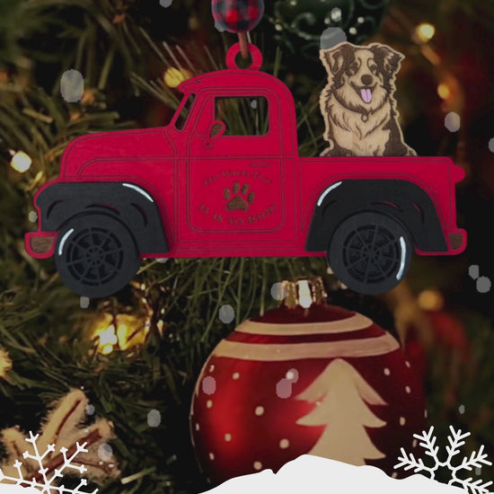 Custom Christmas truck ornament with interchangeable dog breeds, hand-painted details, and rustic leather cord for hanging.